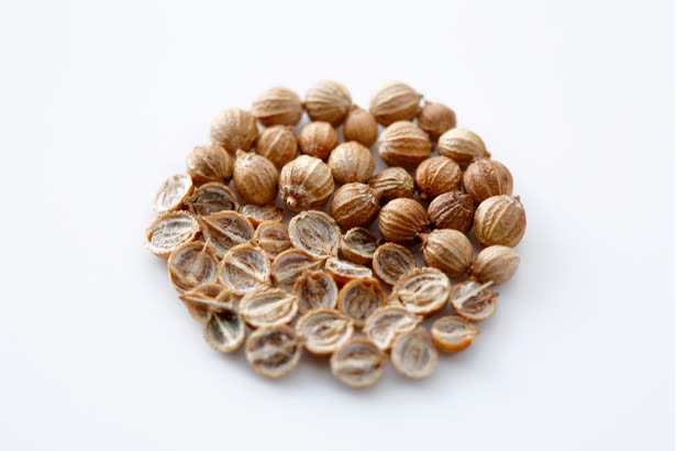 Coriander seeds mechanically split in half
